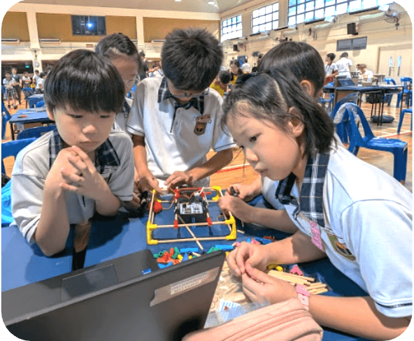 Hands-on workshop session with students practicing STEM activities