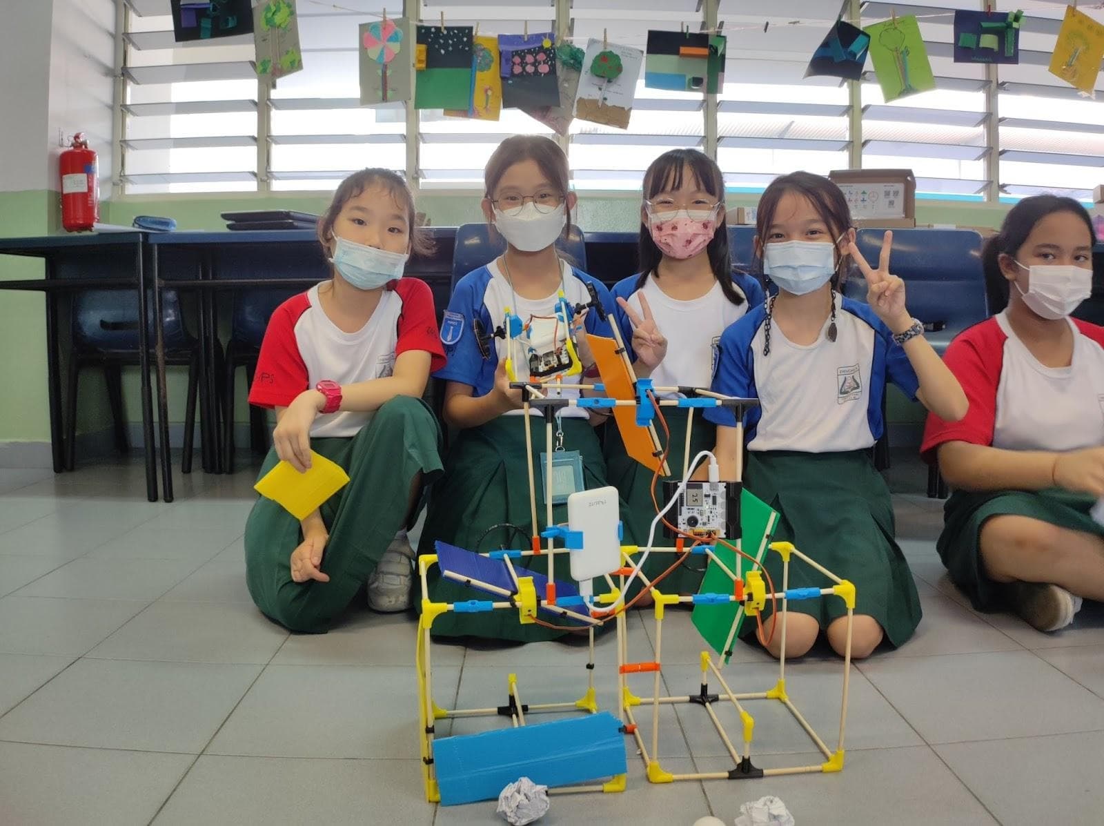 Students building robots during hands-on STEM learning